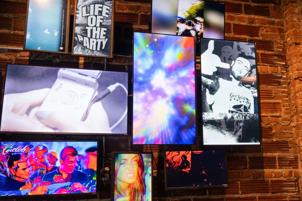 A vibrant collage of retro-style screens at Erie + Vine in downtown Willoughby, featuring nostalgic Y2K visuals, party snapshots, and digital art — reflecting the cocktail bar's throwback aesthetic and community vibe.